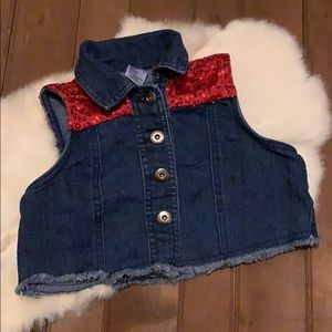 Denim vest with red sequins